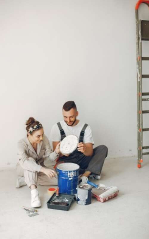 The young and cute family repairs the room